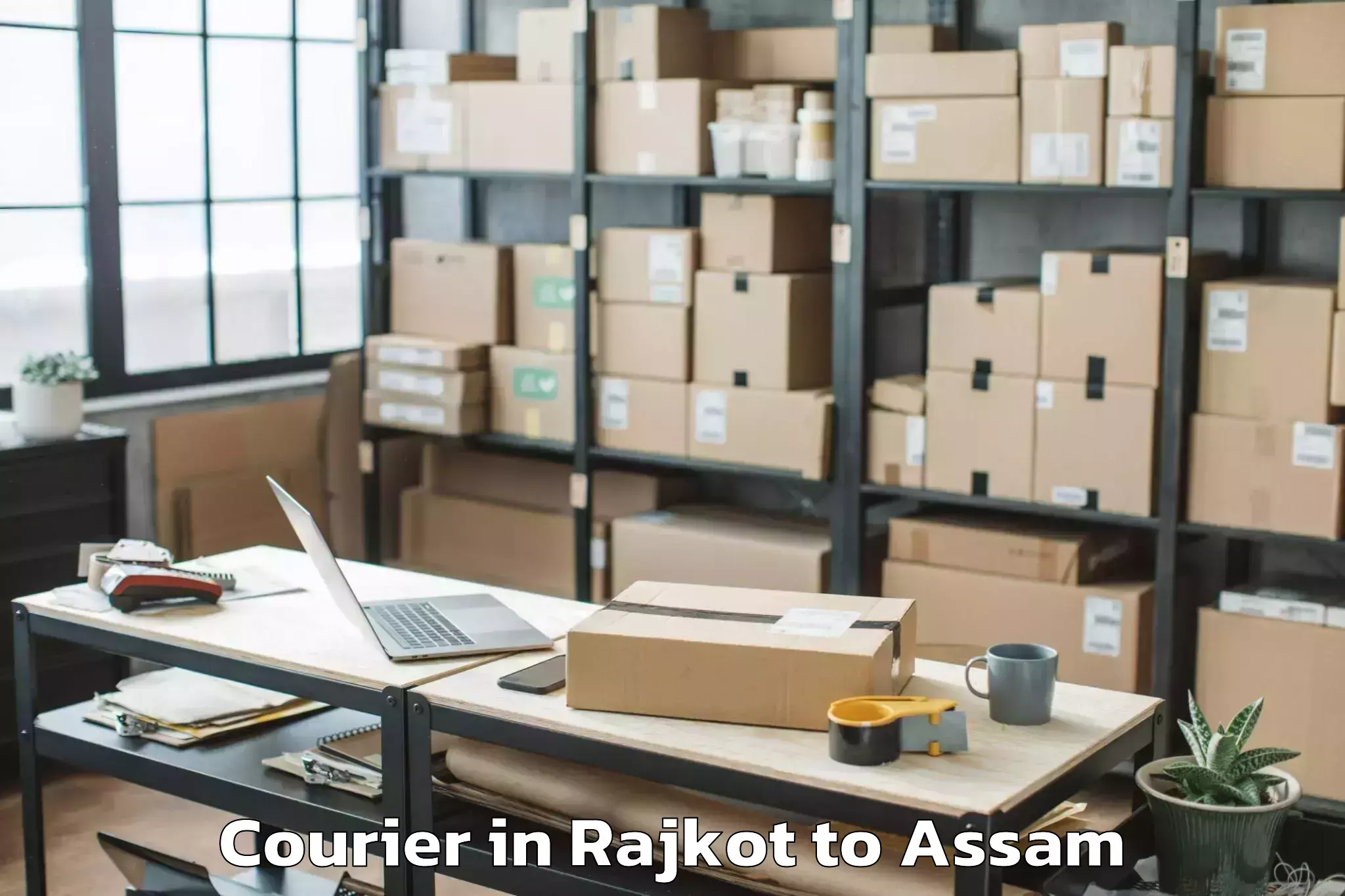 Top Rajkot to Abhilashi University Jorhat Courier Available